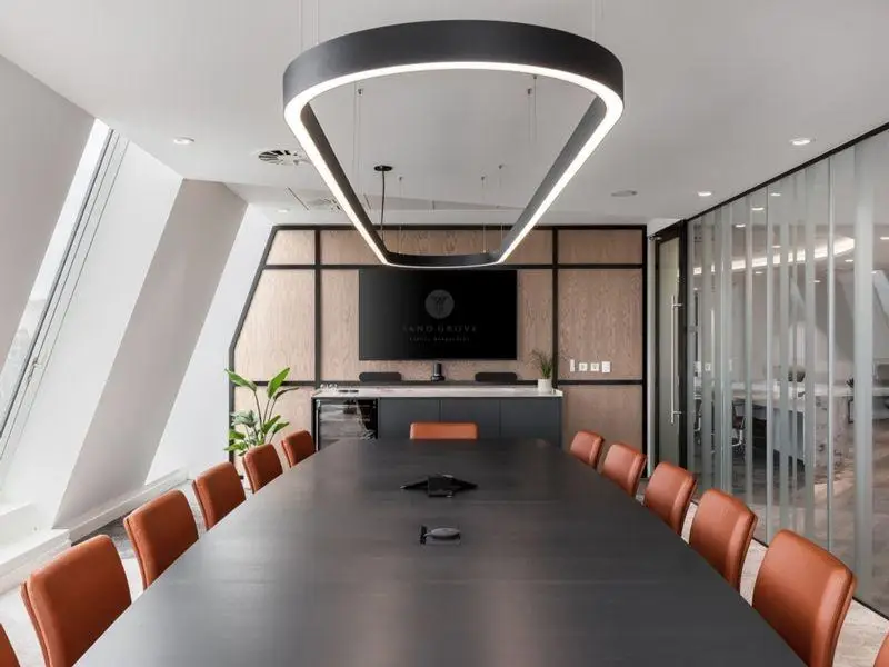 Office conference room with greige painted walls and wood accent panels by a painter in DuPage County, IL.