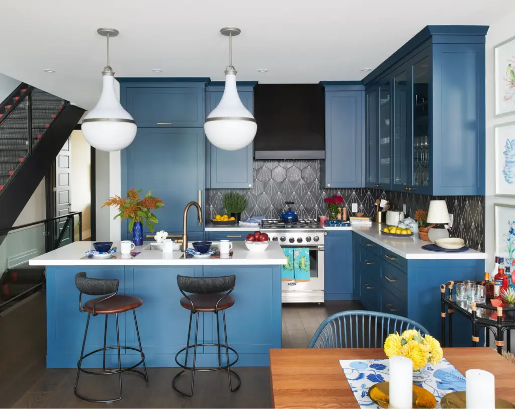 Kitchen with matte blue cabinets, crisp white ceiling and trim by an interior painter in McHenry County, IL.